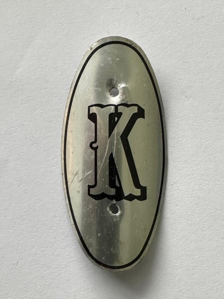 Balhoofdplaatje "K" Kopra rijwiel balhoofd plaatje., Verzamelen, Merken en Reclamevoorwerpen, Ophalen of Verzenden, Gebruikt, Gebruiksvoorwerp
