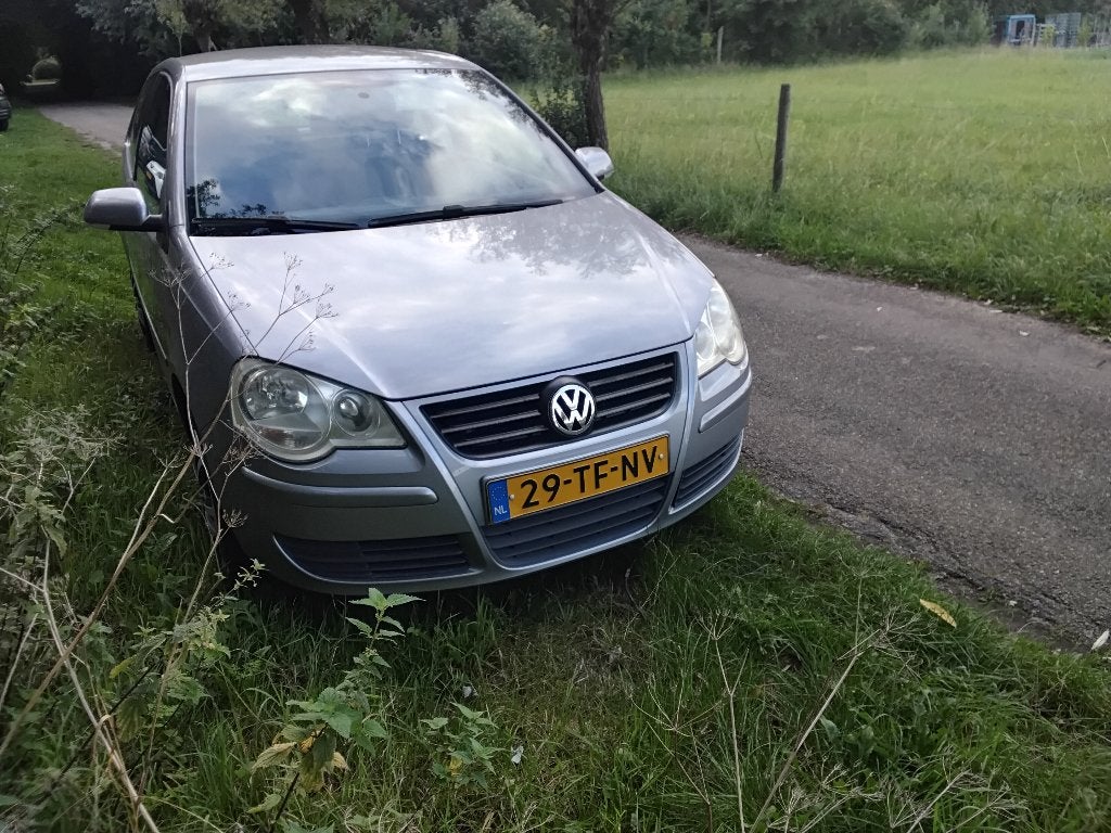 Volkswagen Polo 1.4 55KW AUT 2006 Grijs airco, Auto's, Stof, 4 cilinders, Origineel Nederlands, Particulier