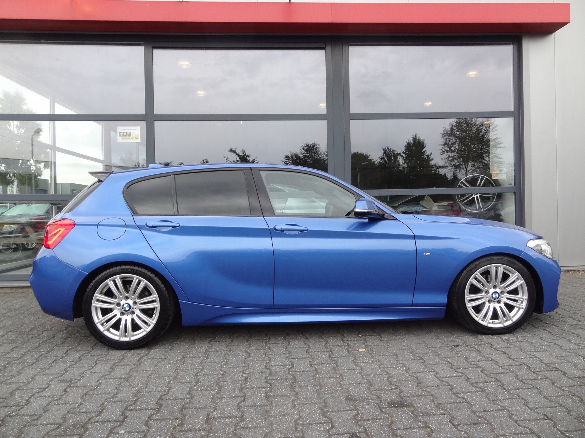 BMW 1-serie 116d Centennial High Executive 2X M-SPORT | NL-A, Auto's, Gebruikt, Blauw, 116 pk, Bedrijf