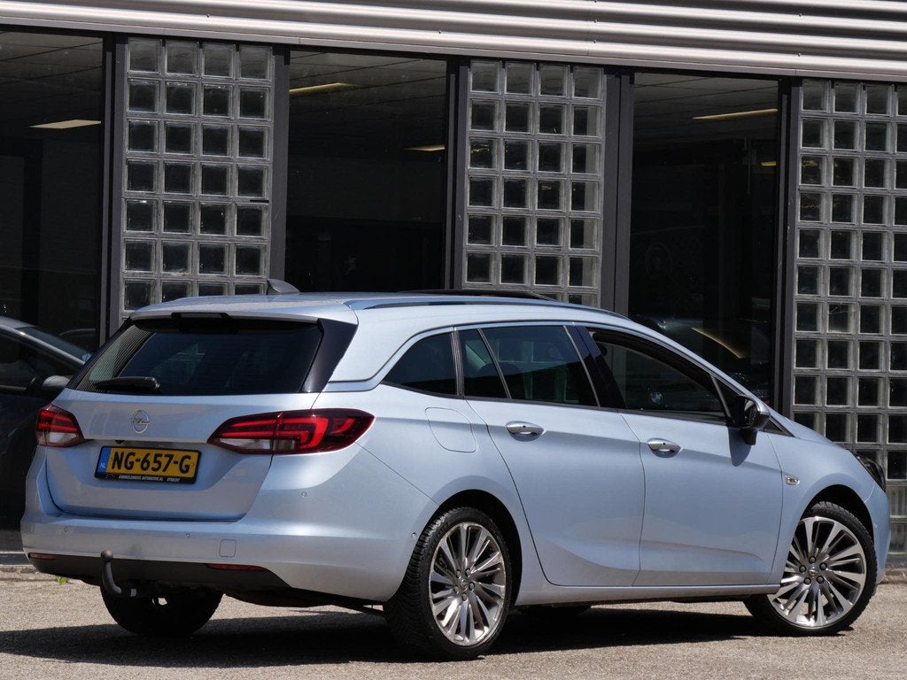 Opel Astra ST 1.4T INNOVATION/ SCHUIFDAK/ TREKHAAK/ BLIS/ CA, Auto's, Parkeersensor, Stof, Gebruikt, 4 cilinders