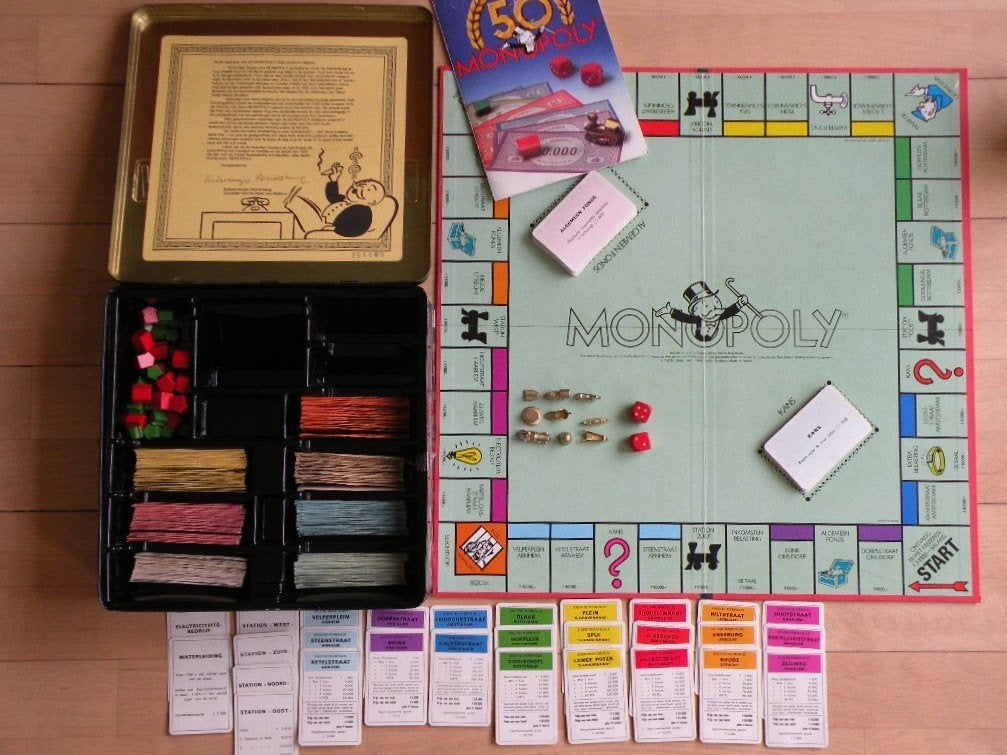 Monopoly 1935-1985. In blik.Commemorative edition. Als nieuw, Hobby en Vrije tijd, Gezelschapsspellen | Bordspellen, Ophalen of Verzenden