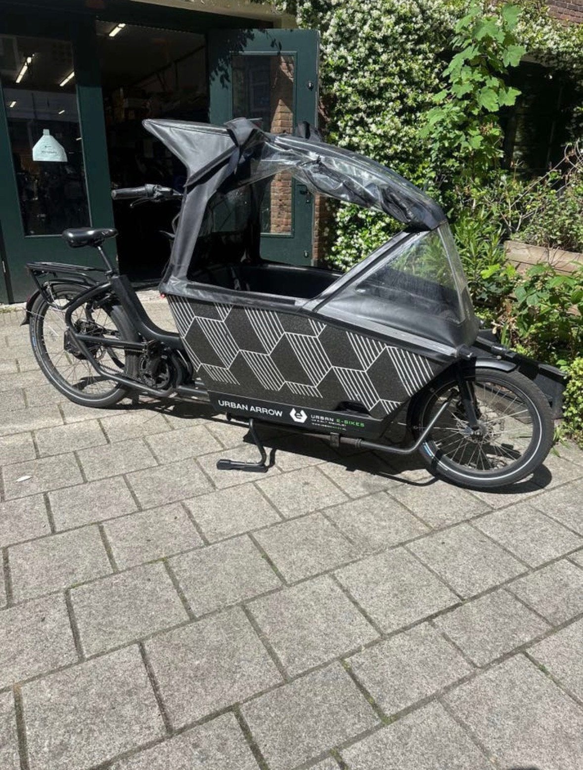 Gezocht Urban Arrow Regenhuif plus, Ophalen of Verzenden, Zo goed als nieuw, 1 kind