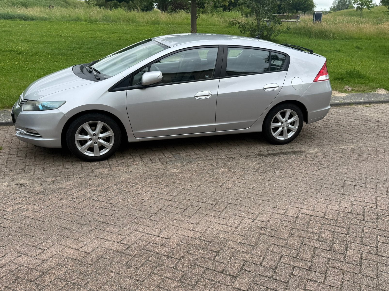 Honda Insight 1.3 Hybrid AUT 2010 Grijs, 4 cilinders, 22 km/l, Zilver of Grijs, Te koop