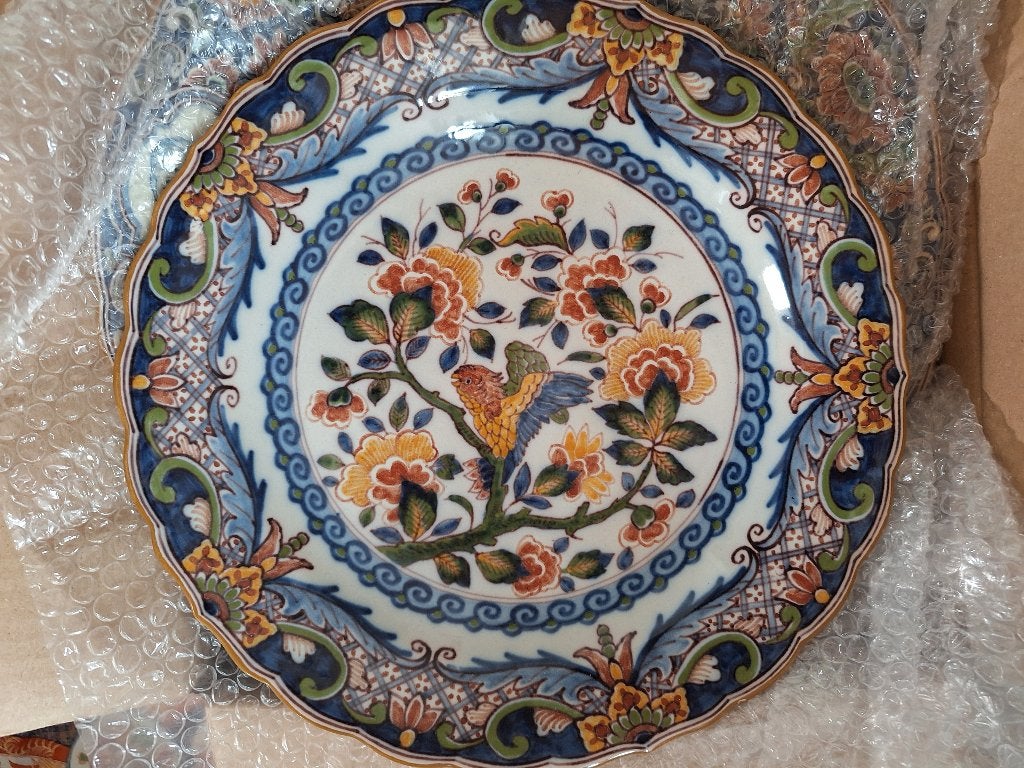 Makkums blauw aardewerk wandborden, Ophalen