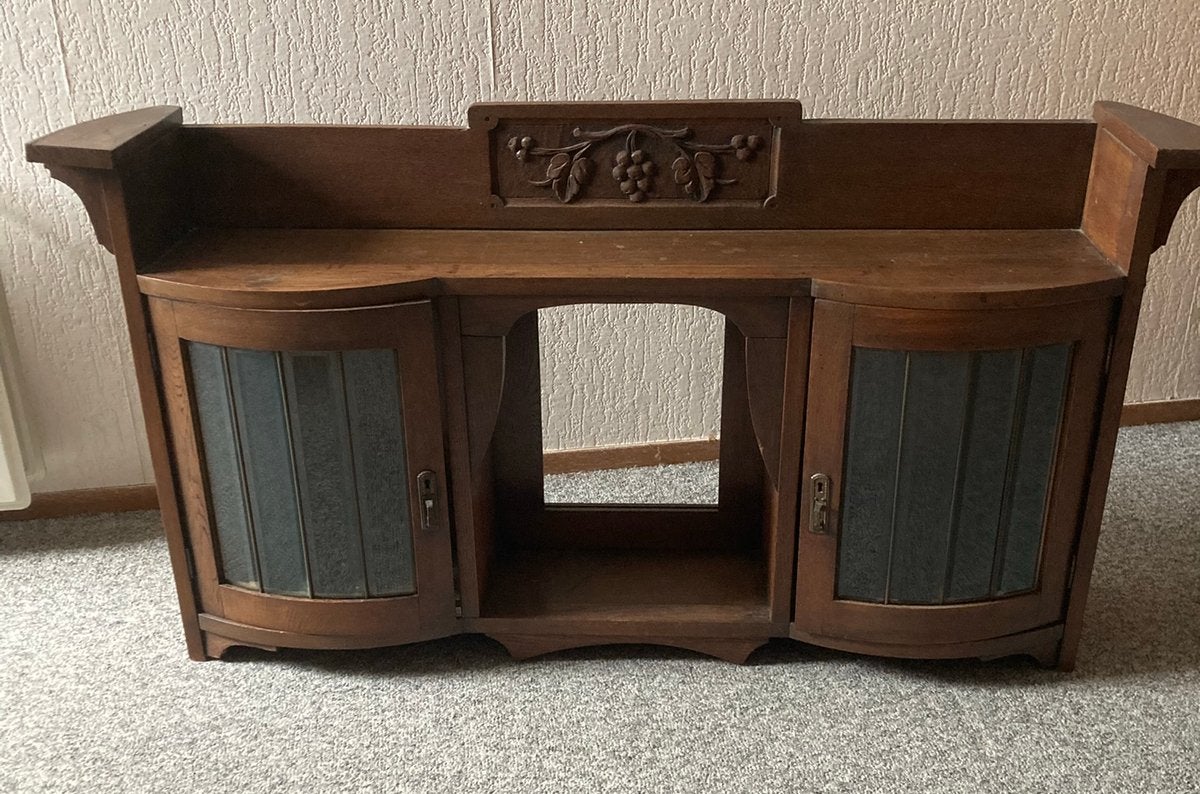Antiek dressoir met gesneden details en glas-in-lood, Ophalen