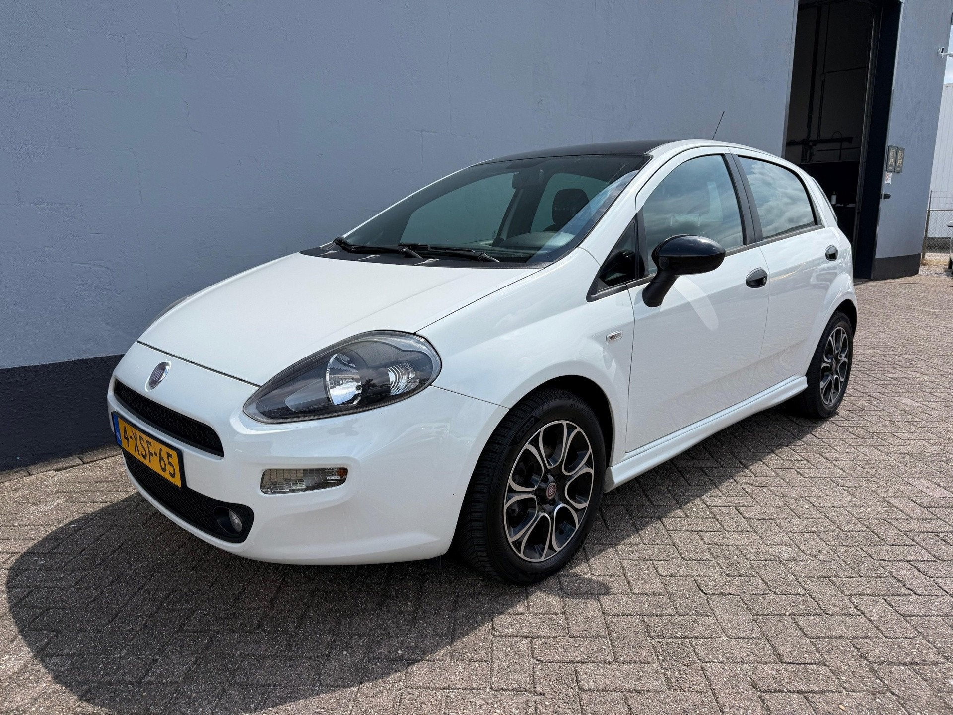 Fiat Punto Evo 0.9 TwinAir Racing 5-Deurs - Airco - LMV, Auto's, Fiat, Voorwielaandrijving, 101 pk, Gebruikt, Euro 6