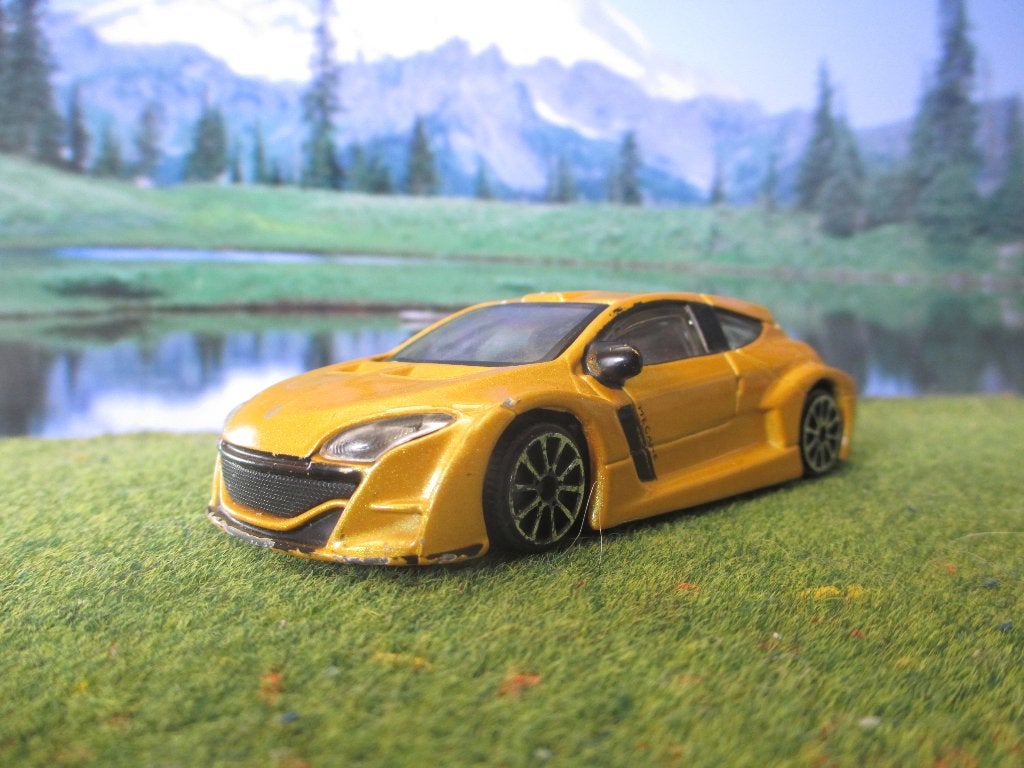 1:43 Renault Mégane Trophy - Bburago metallic-geel, Ophalen of Verzenden, Gebruikt, Auto, Overige merken