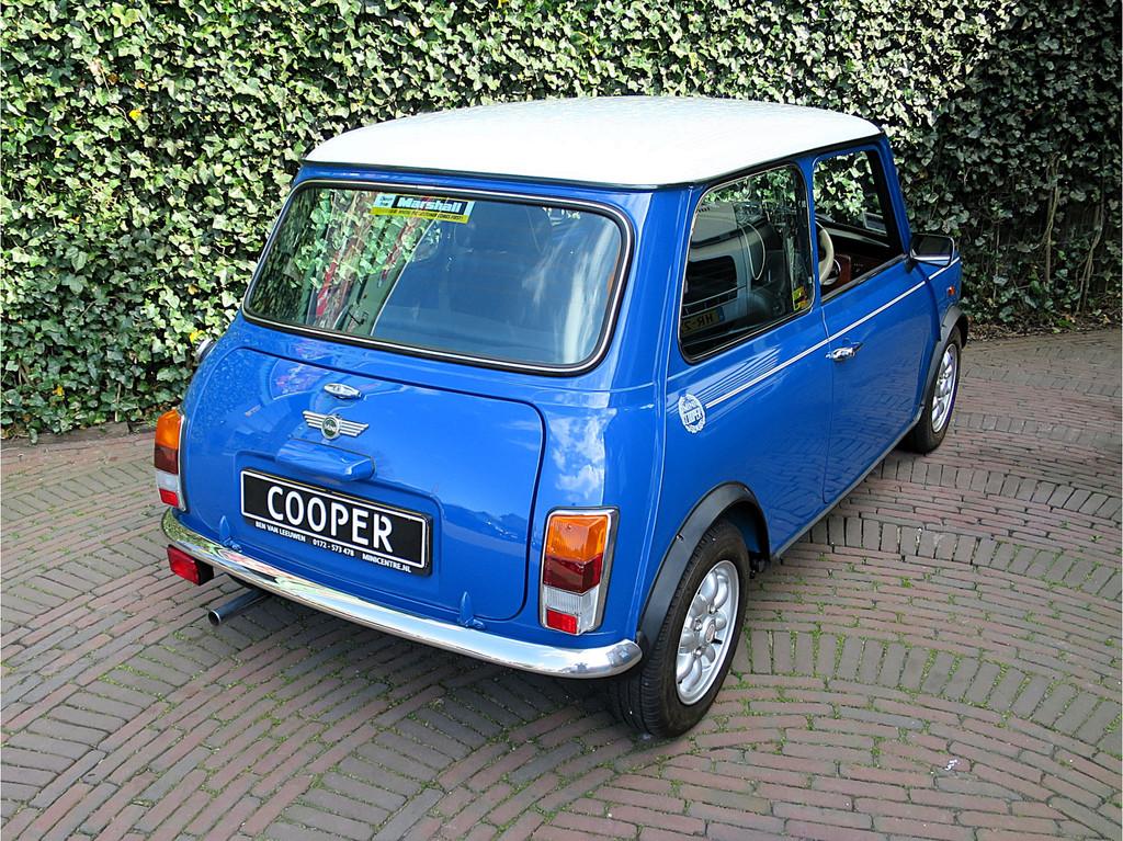 MINI Cooper 1.3 MPI Unieke auto met zeer lage km-stand!, Voorwielaandrijving, 12 maanden, 54 pk, Zwart