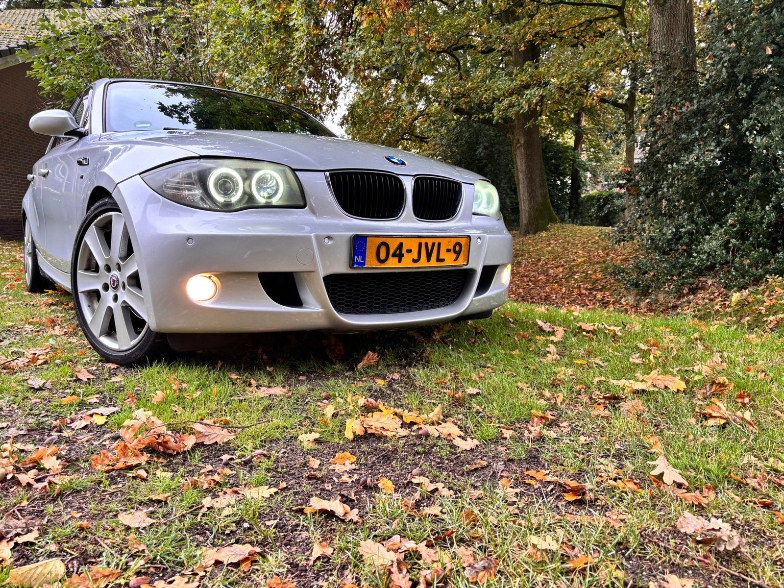 BMW 1-Serie 2.0 118I 5DR 2007 Grijs met pano dak en M-Pakket, Achterwielaandrijving, 1995 cc, Zwart, Leder en Stof