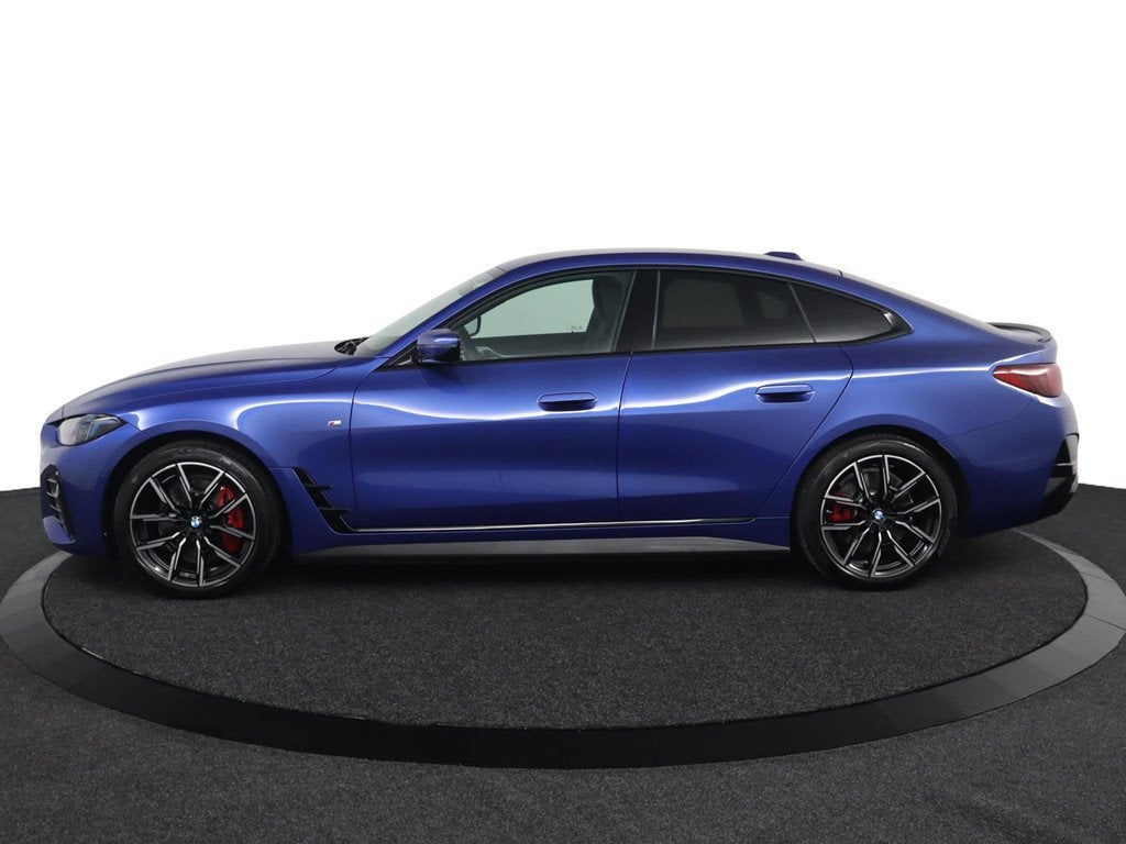 BMW i4 eDrive35 M Sport Edition 70 kWh | SOH 100% | M Sport, Auto's, BMW, Gebruikt, Zwart, Met garantie (alle), Blauw