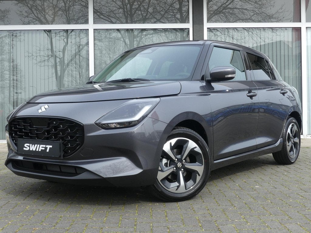 Suzuki Swift 1.2 Style Smart Hybrid NIEUW uit voorraad lever, Auto's, Suzuki, Voorwielaandrijving, 12 maanden, Stof, Bedrijf