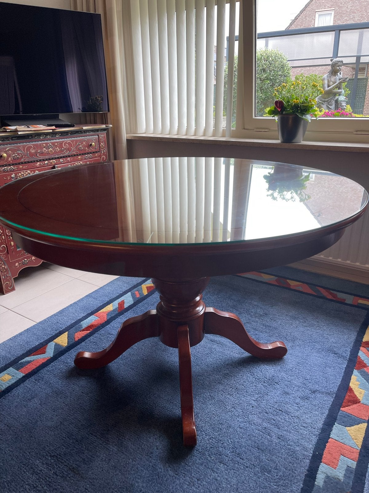 Ronde eettafel met glazen blad, Ophalen