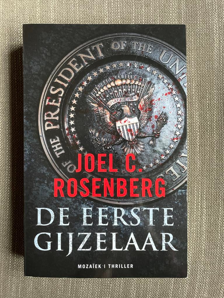 Joel C. Rosenberg - De eerste gijzelaar, Zo goed als nieuw, Amerika, Joel C. Rosenberg, Ophalen of Verzenden