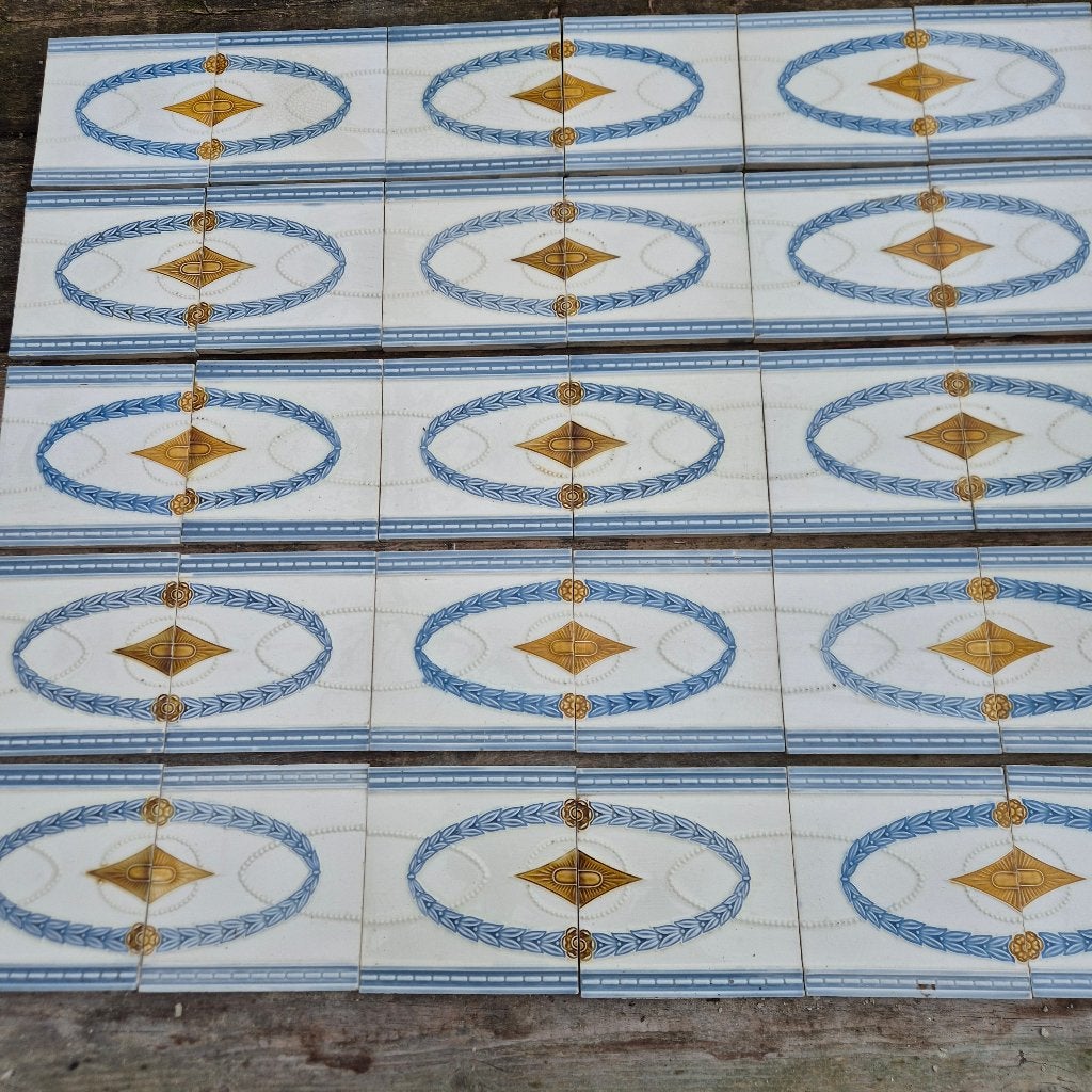 63 Art nouveau randtegels opgelegd decor blauw goudbruin, Ophalen