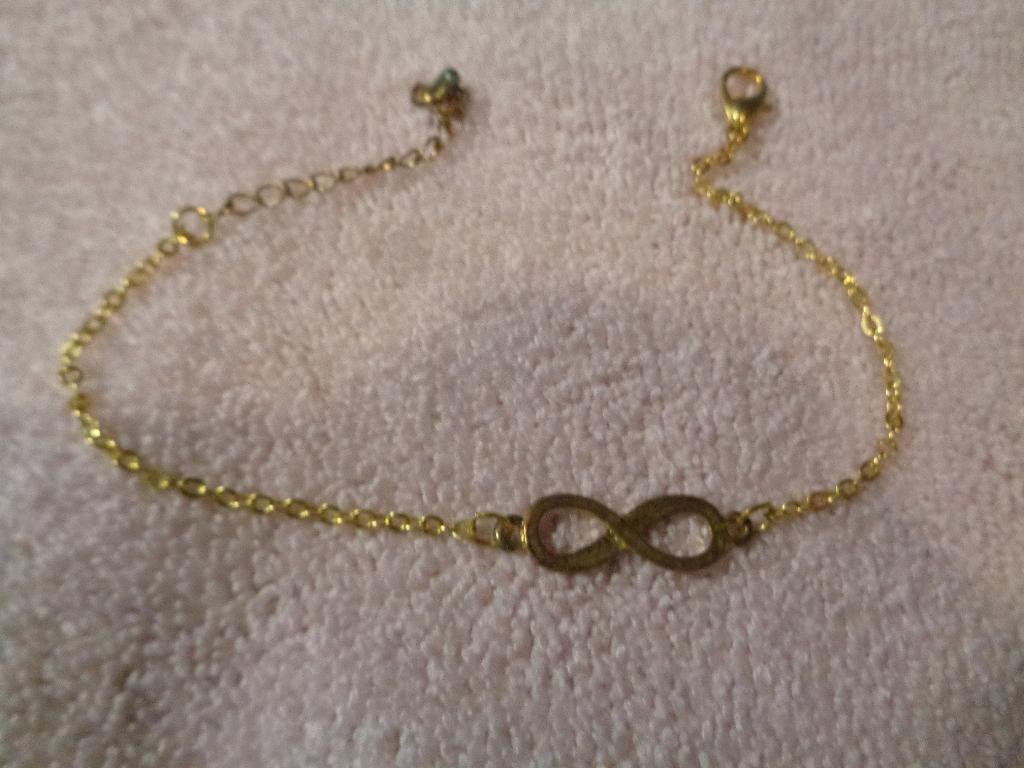 goudkleurige armband met krakeling nr arm 987, Ophalen of Verzenden, Nieuw, Goud, Overige materialen