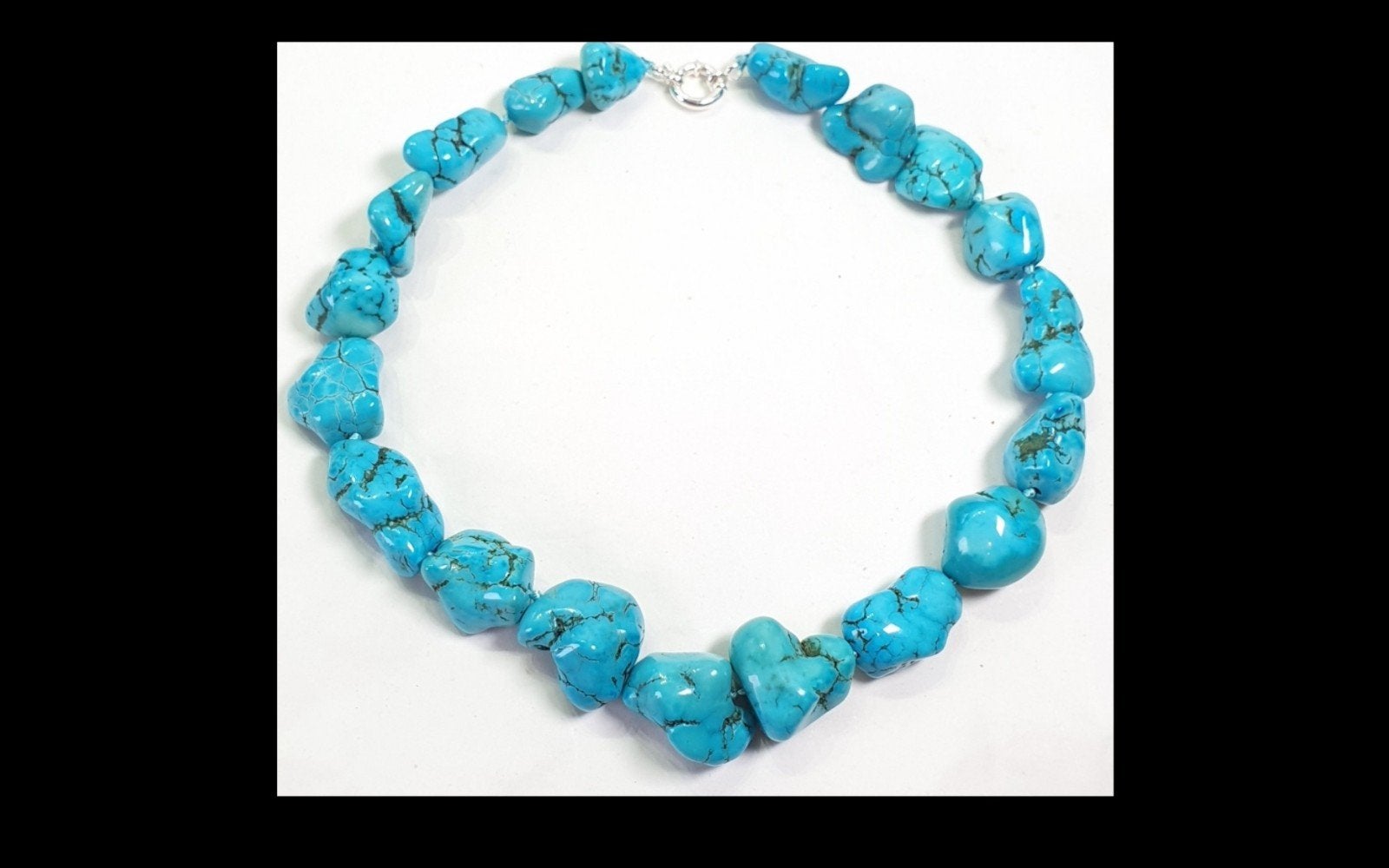 Foto 4 van Prachtig handgesponnen ketting met Turquoise.