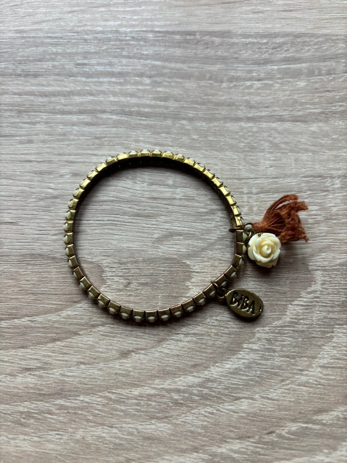 BIBA armband goud wit steentjes en roos, Ophalen of Verzenden, Zo goed als nieuw, Wit, Overige materialen