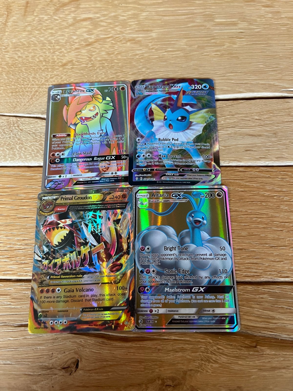 Pokémon kaarten: Lycanroc, Vaporeon, Primal Groudon, Altaria, Ophalen of Verzenden, Zo goed als nieuw, Meerdere kaarten, Foil