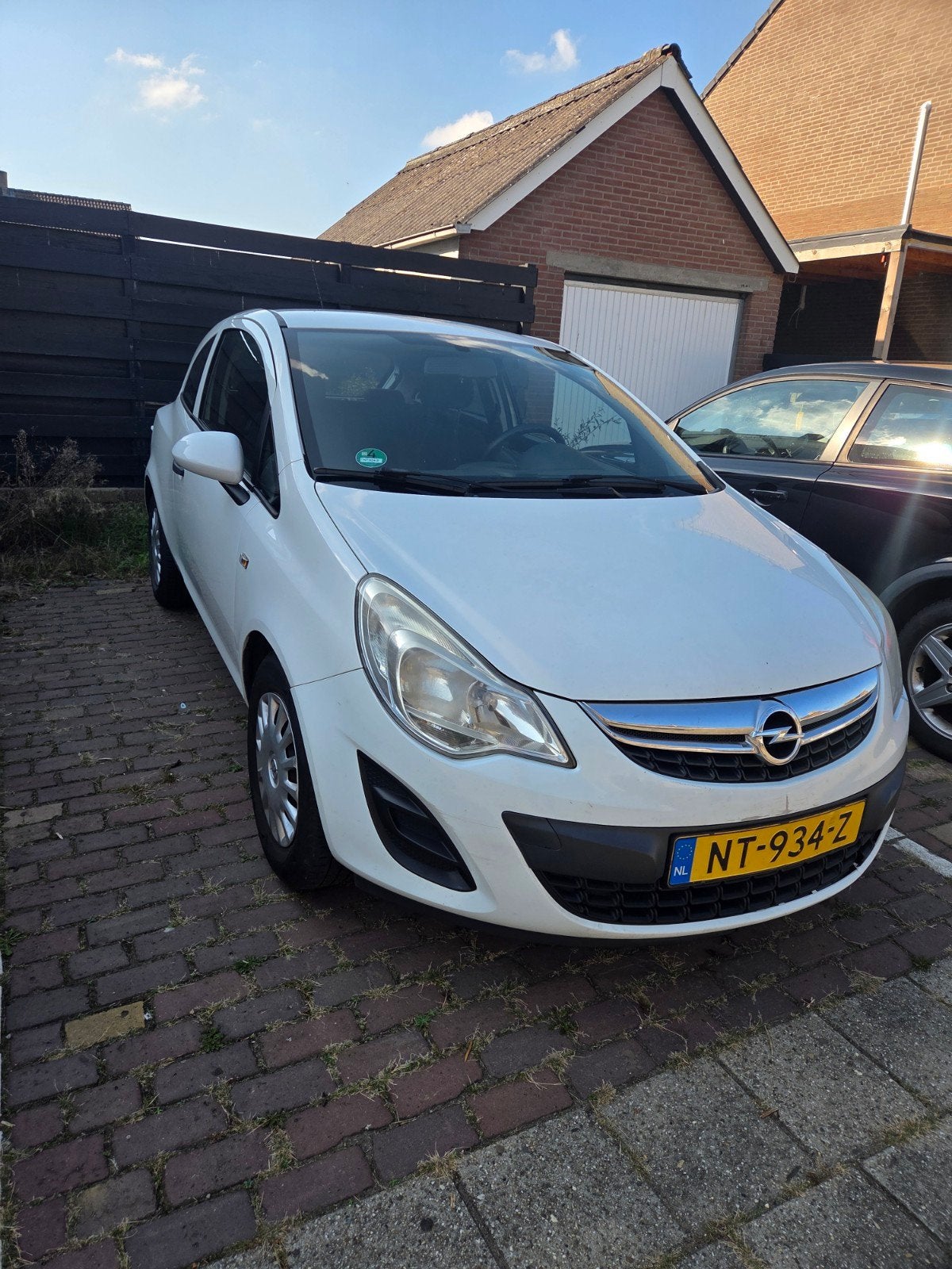 Opel Corsa 2012 2E EIGENAAR, Auto's, Voorwielaandrijving, Stof, Wit, Handgeschakeld
