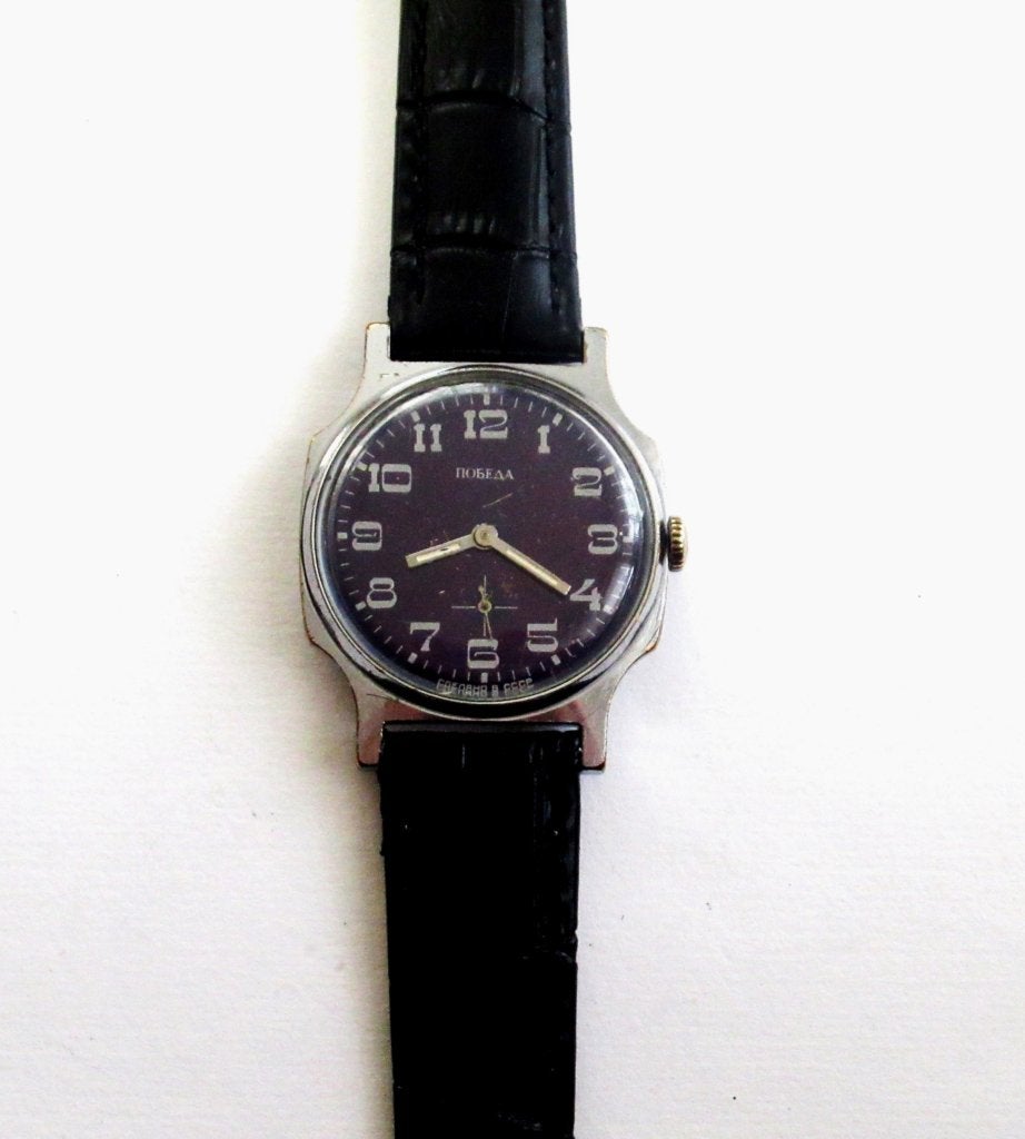 Pobeda vintage mechanisch heren horloge van de jaren 80., Ophalen of Verzenden, Gebruikt, Leer, Overige merken