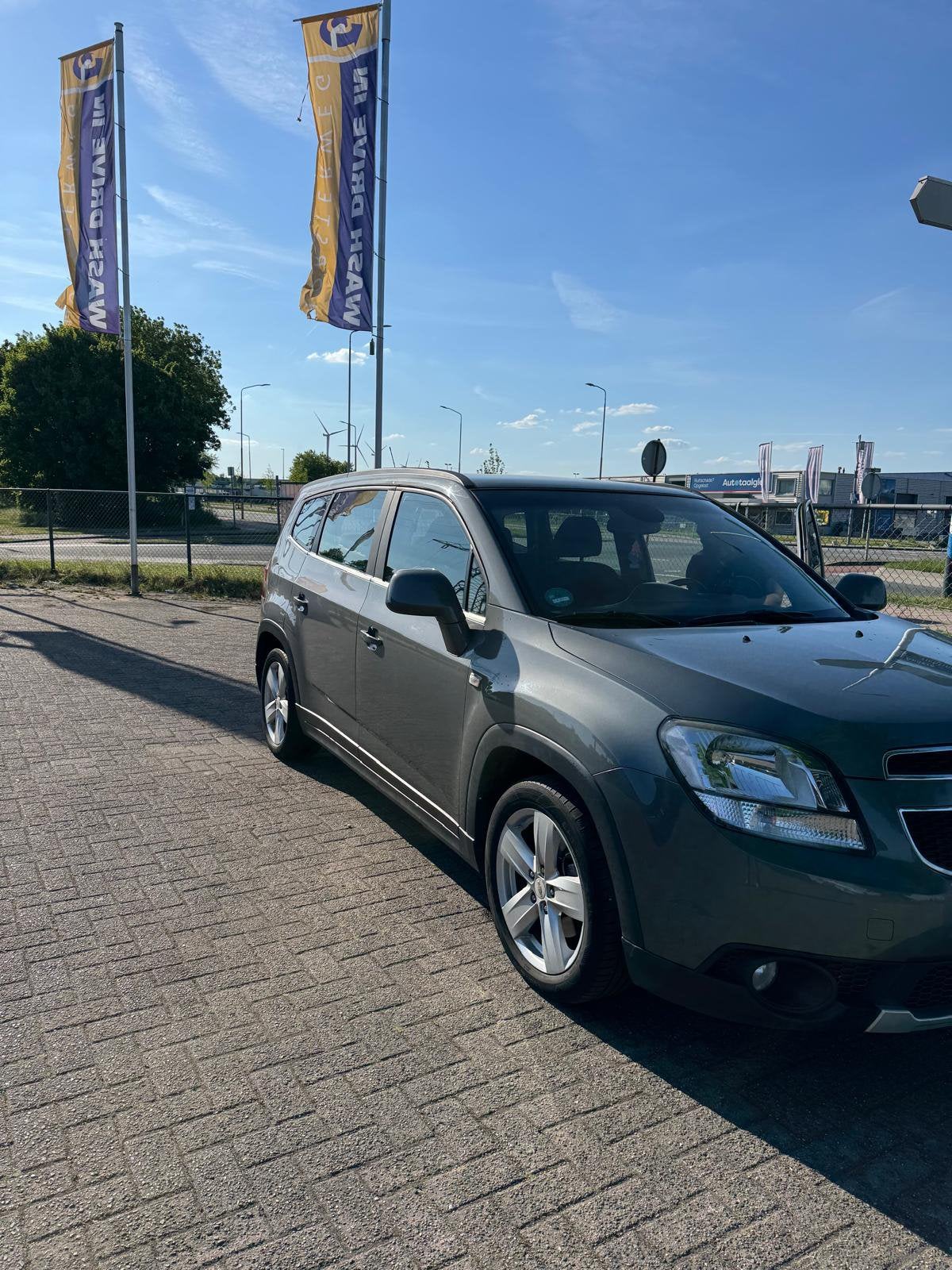 Chevrolet Orlando 1.8 AUT 2012 Grijs, Auto's, Chevrolet, Zwart, Particulier, 93 €/maand, Zilver of Grijs