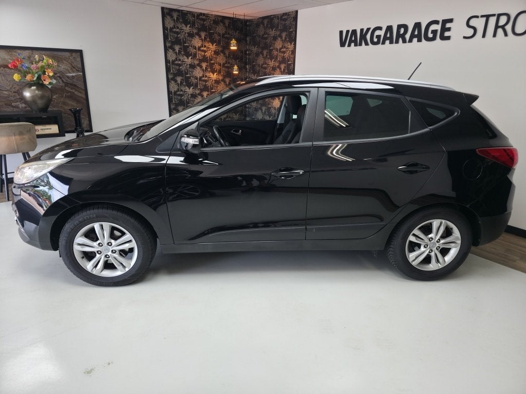 Hyundai ix35 2.0i Bus.Ed. | cruise | cam | clima | trekhaak, Auto's, Hyundai, Gebruikt, Zwart, 4 cilinders, Leder en Stof