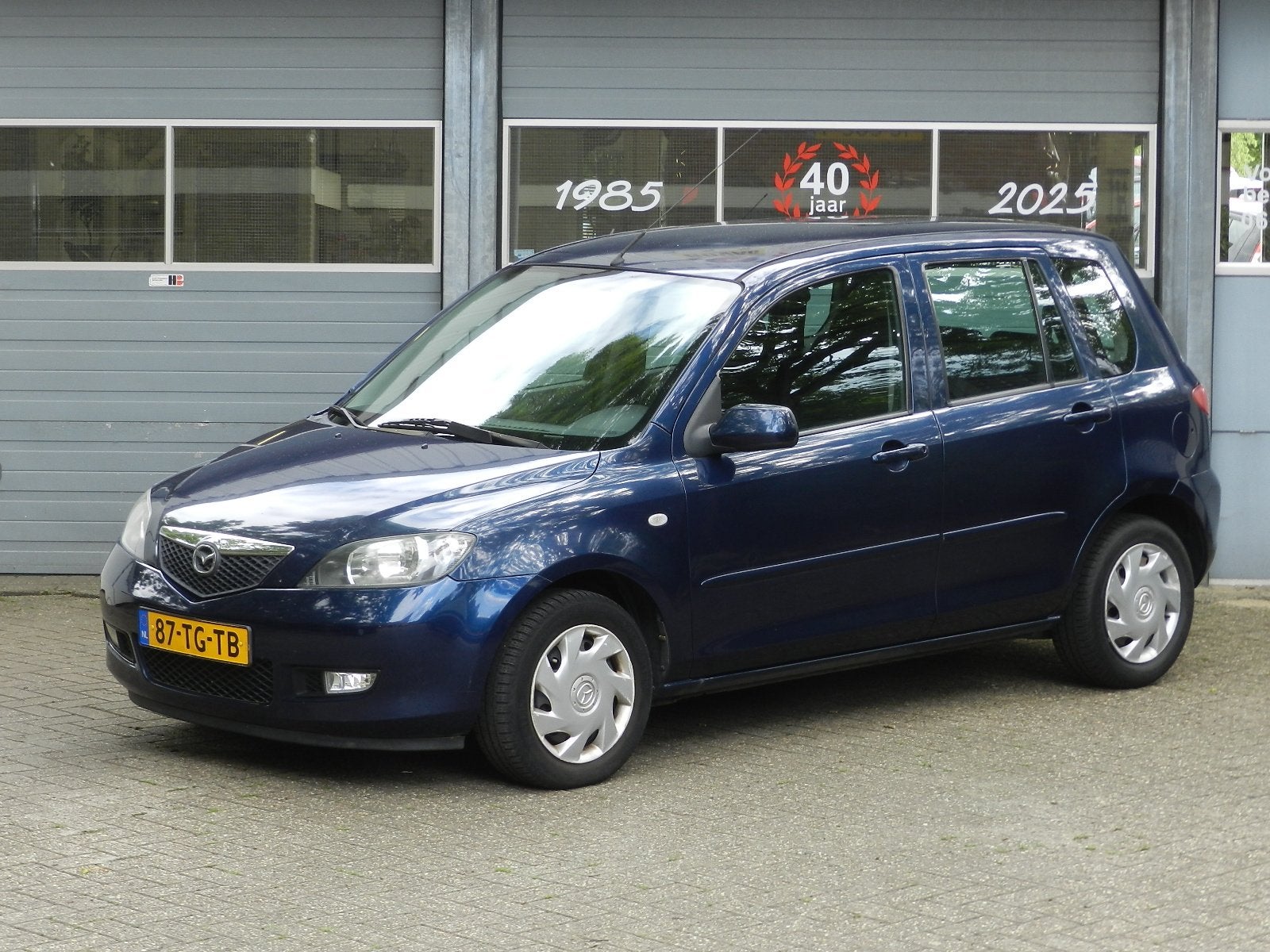 Mazda 2 1.4 Exclusive 5Deurs Metallic lak Airco Electrische, Auto's, Voorwielaandrijving, Dealer onderhouden, Zwart, 4 cilinders