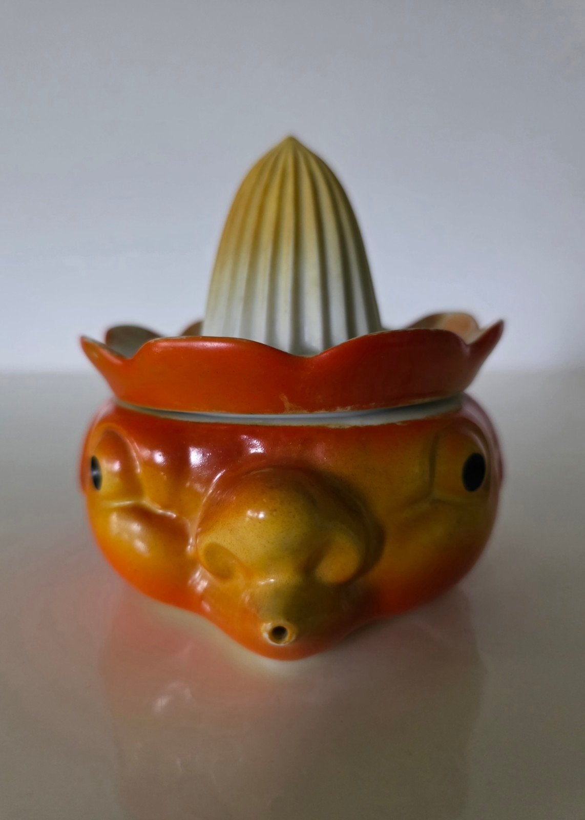 Vintage oranjekleurige citruspers, met een gezicht, Ophalen of Verzenden