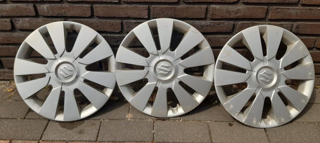 3 originele 14 inch wieldoppen Suzuki Alto, Ophalen, Gebruikt