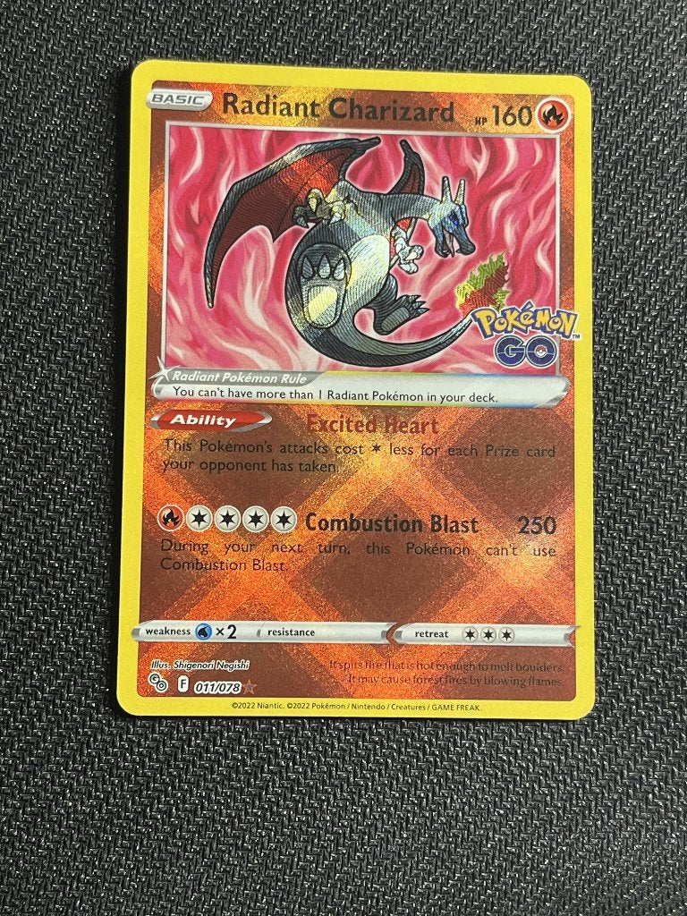 Radiant Charizard (PGO 011), Ophalen of Verzenden, Nieuw, Losse kaart, Foil