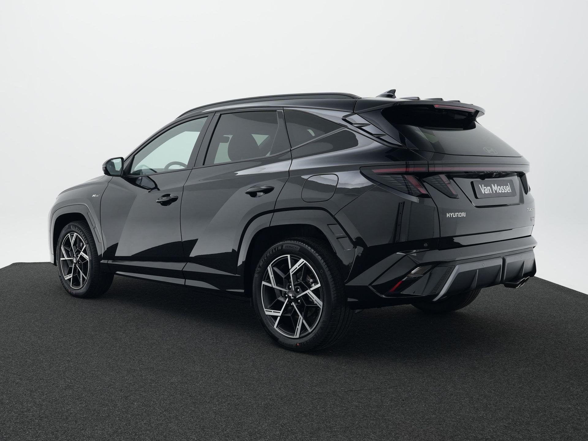 Hyundai Tucson 1.6 T-GDI HEV N Line Sky | Panorama dak | Sto, Auto's, Dealer onderhouden, 4 cilinders, Met garantie (alle), Zwart
