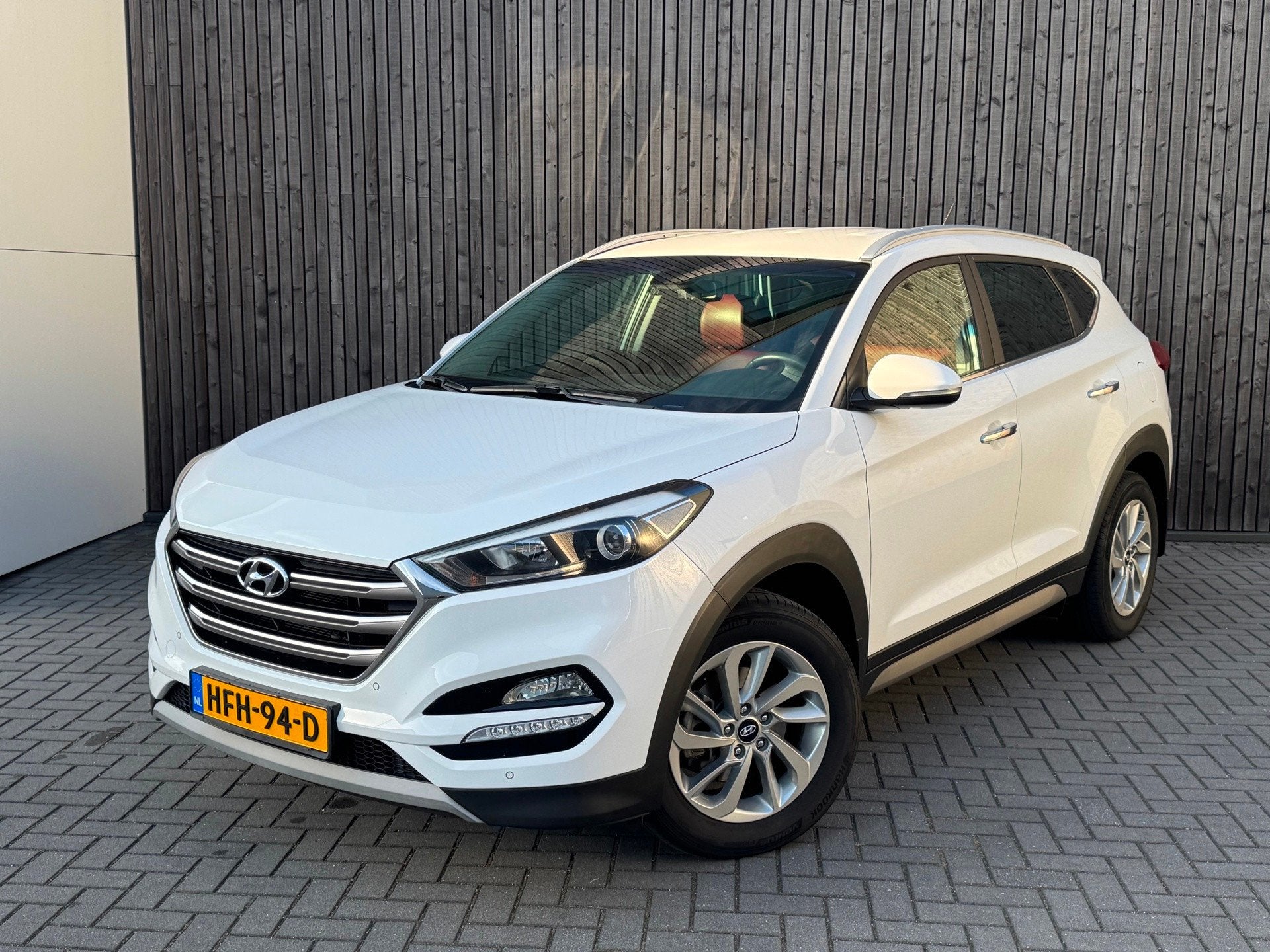 Hyundai Tucson 1.6 T-GDi Premium 4WD 177pk leder, Auto's, Gebruikt, 1591 cc, 4 cilinders, Wit