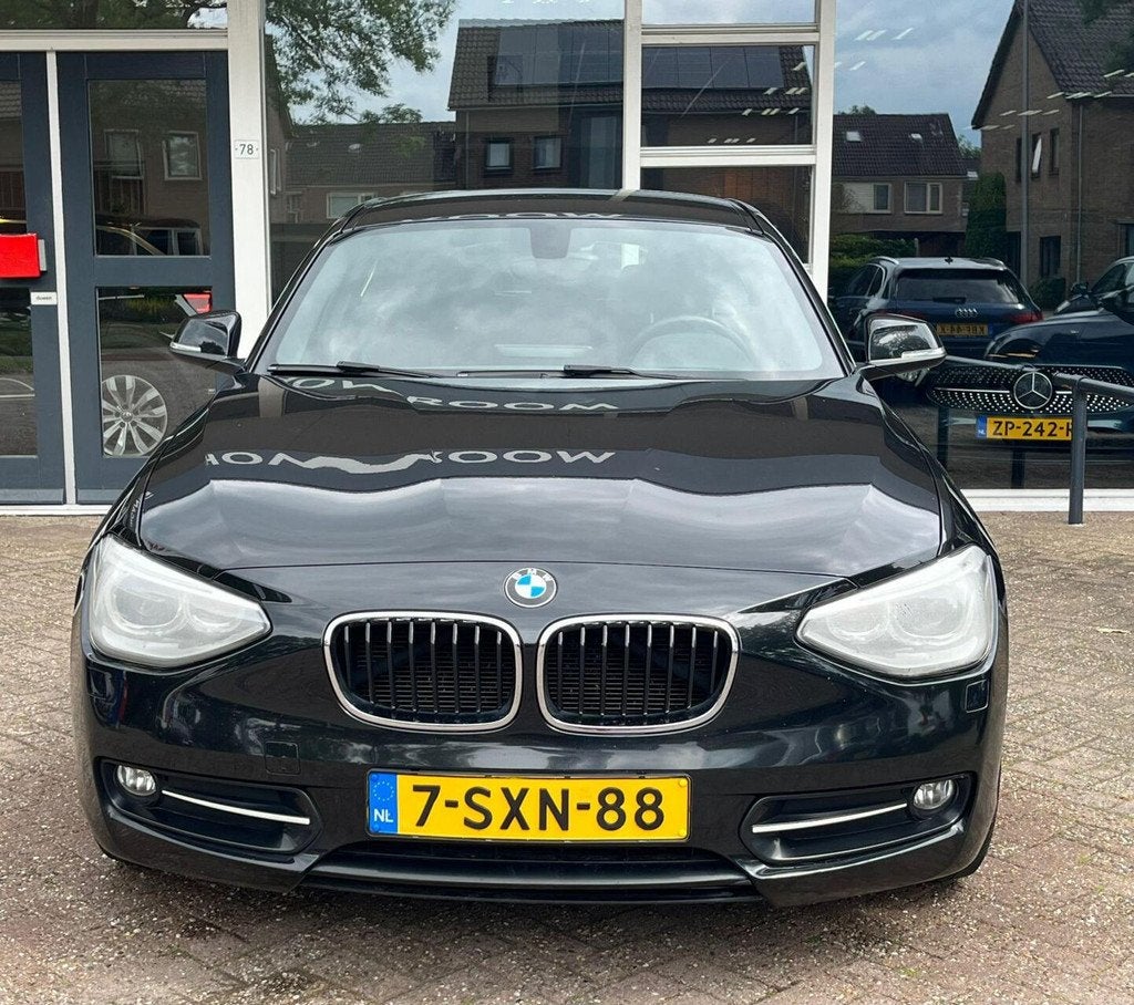 BMW 1-serie 116i High Executive Xenon/Led, Climat, Airco, Na, Auto's, Euro 6, 4 cilinders, Automatische klimaatregeling, Zwart