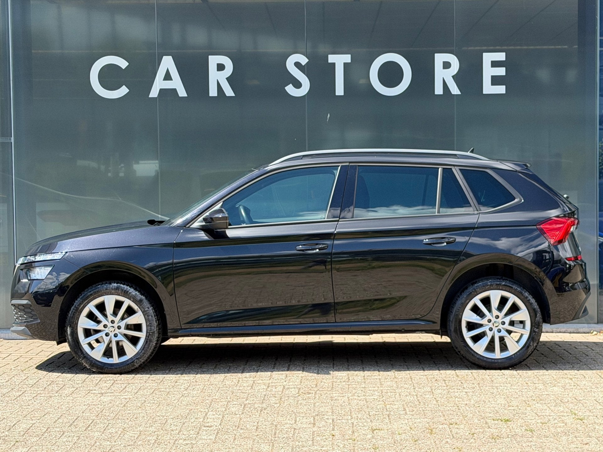 Skoda Kamiq 1.0 TSI Sport Business Navigatie/Apple Carplay/C, Stof, Gebruikt, Zwart, Origineel Nederlands