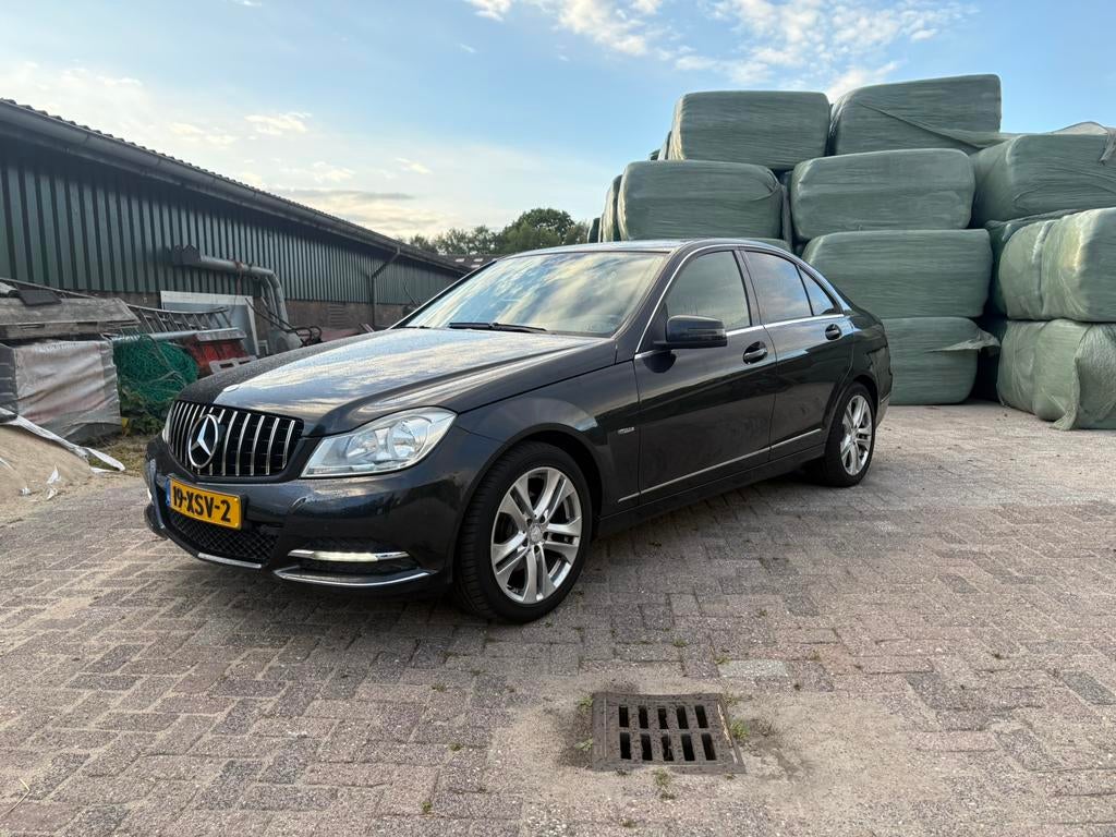 Mercedes-Benz C-Klasse 1.8 C180 CGI Sedan AUT 2012 Zwart, Auto's, Automaat, 745 kg, 1800 kg, Zwart