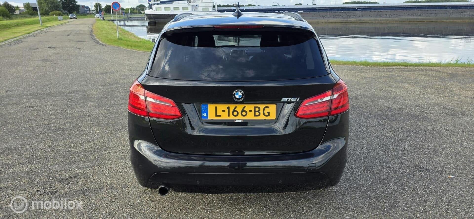 BMW 2-serie Active Tourer 216i High Executive, 97000km A, Auto's, Voorwielaandrijving, Gebruikt, Euro 6, Zwart