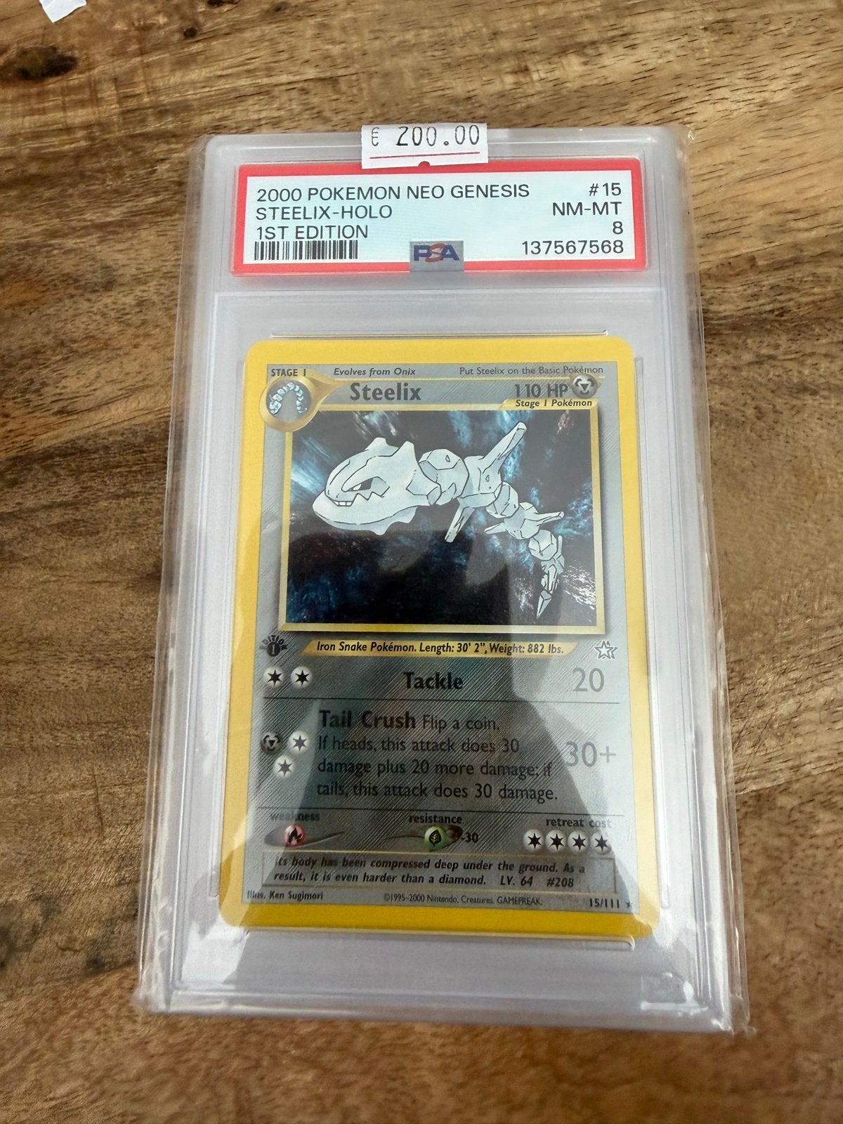 Pokémon Neo Genesis Steelix-Holo 1st Edition PSA 8, Ophalen of Verzenden, Zo goed als nieuw, Losse kaart, Foil