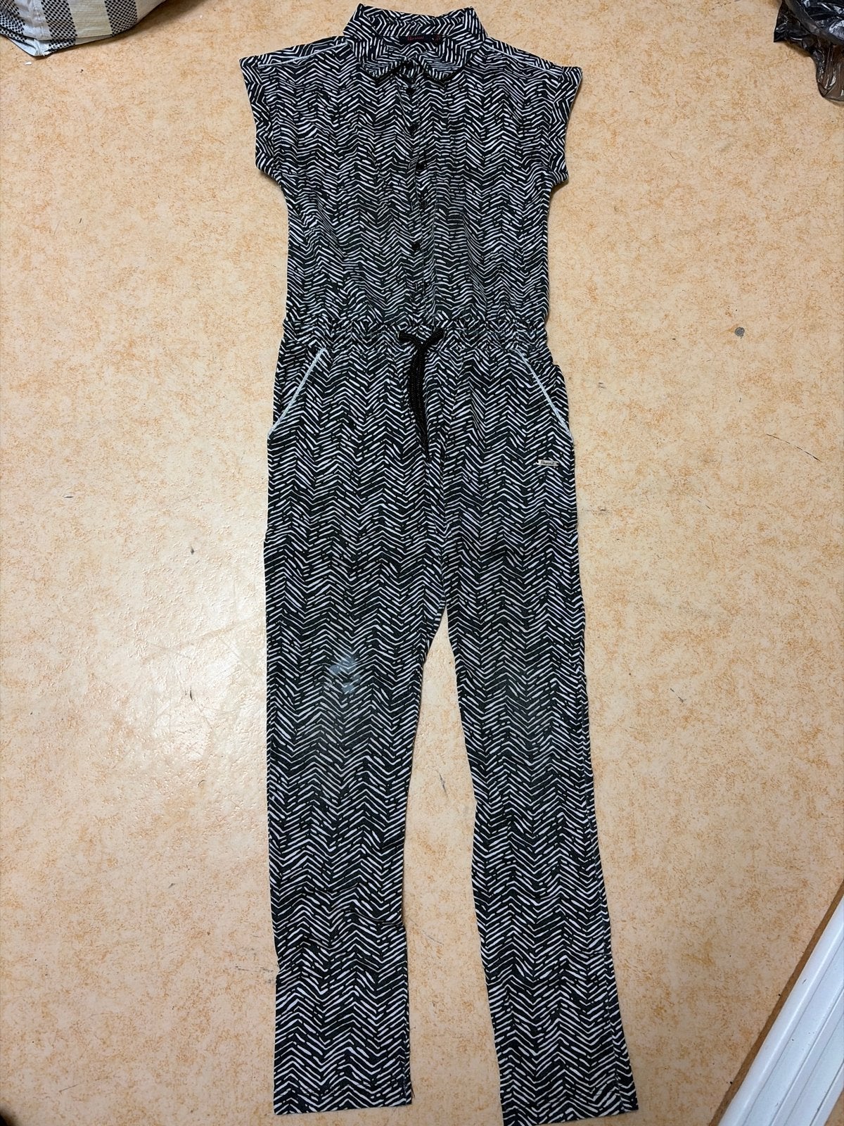 Zwarte jumpsuit met witte print, Kinderen en Baby's, Ophalen of Verzenden, Zo goed als nieuw, Meisje, Overige typen