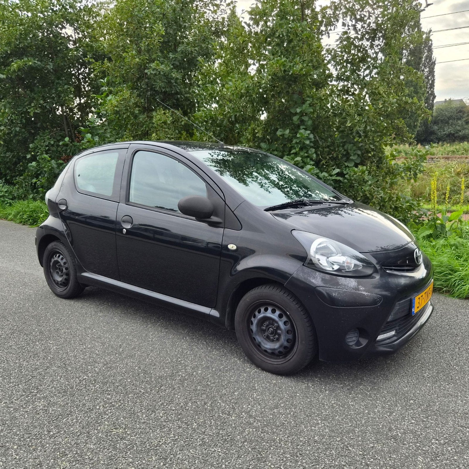Toyota Aygo 1.0 12V Vvt-i 5DRS 2012 Zwart, Auto's, Voorwielaandrijving, 4 stoelen, Origineel Nederlands, Handgeschakeld