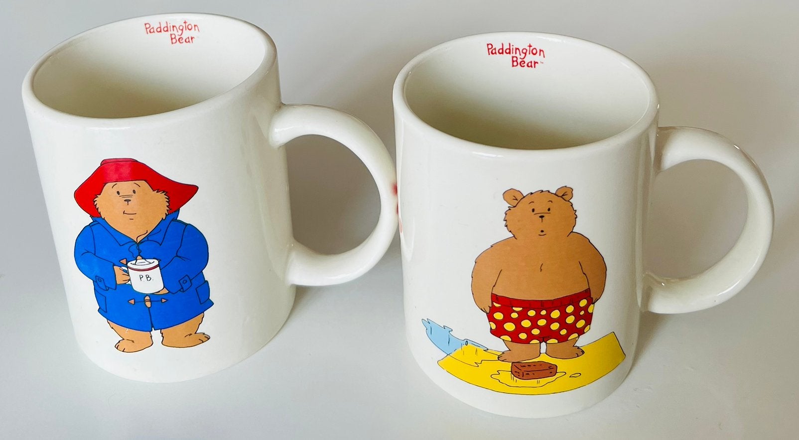 2 mokken Paddington Bear , Douwe Egberts, Ophalen of Verzenden, Zo goed als nieuw, Overige stijlen, Kop(pen) en/of Schotel(s)