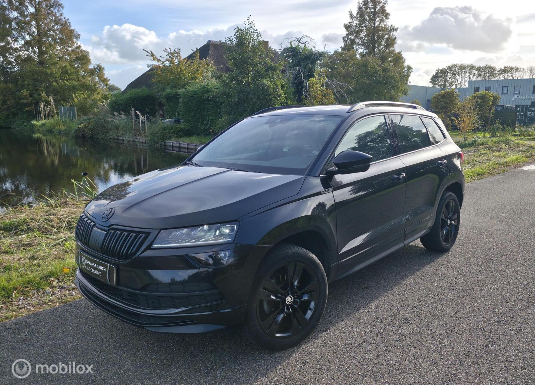 Skoda Karoq 1.5 TSI ACT Sportline / Canton / Leder / Camera, Auto's, 4 cilinders, 150 pk, Zwart, Bedrijf