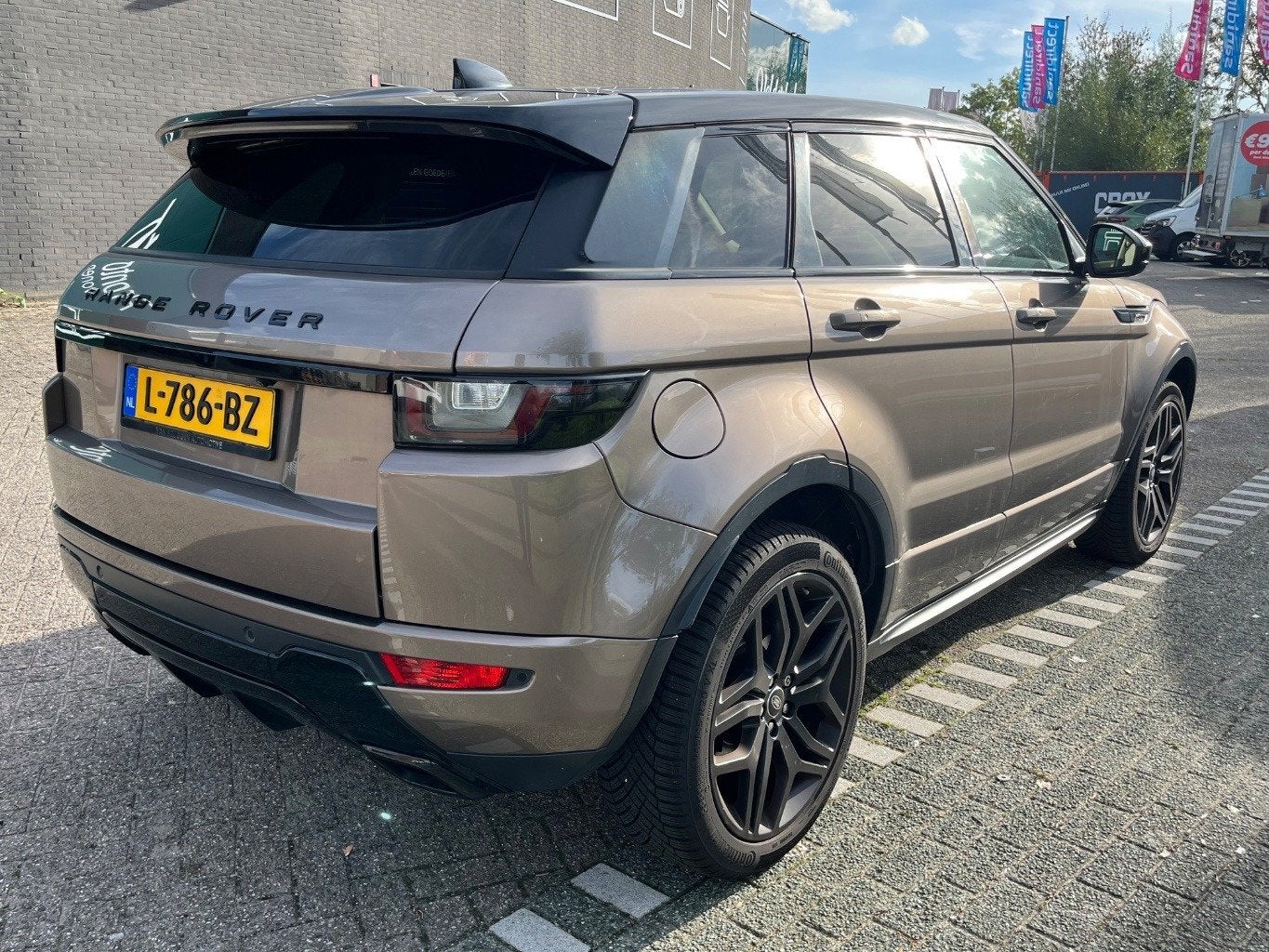 Land Rover Range Rover Evoque 2.0 Si4 Autobiography, Navi, C, Auto's, Dealer onderhouden, 4 cilinders, Bruin, Leder