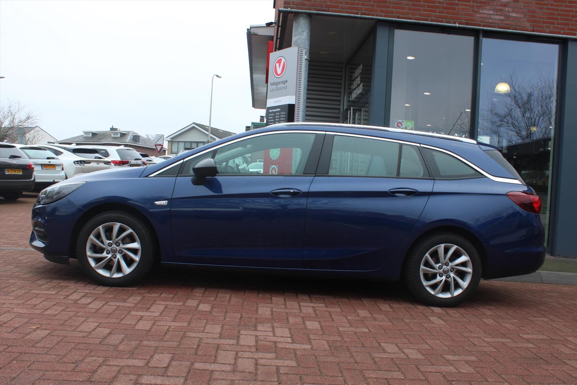 OPEL Astra Sports Tourer 1.4 Turbo Aut. *Business* | Trekhaa, Auto's, Opel, 145 pk, Gebruikt, Blauw, Leder en Stof