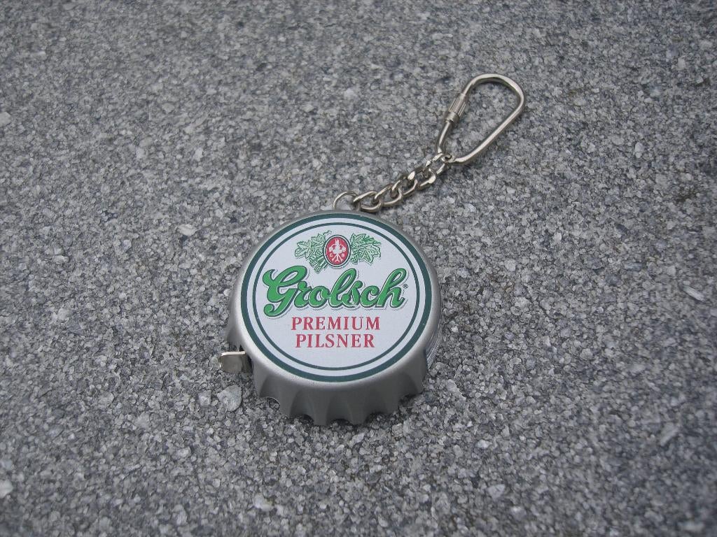 Grolsch sleutelhanger met meetlint en omrekentool NLG naar €, Ophalen of Verzenden, Nieuw, Overige typen, Grolsch