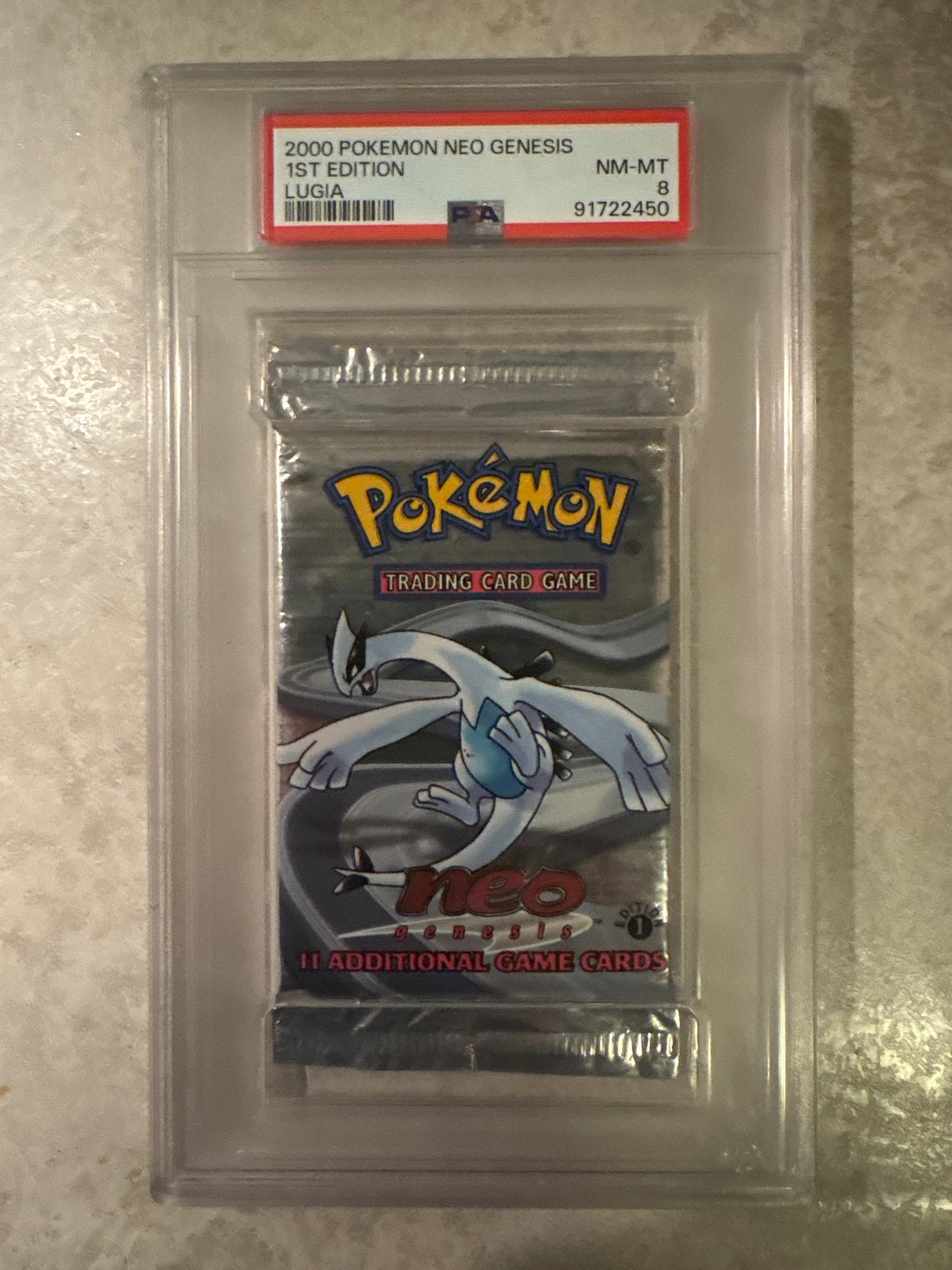 Pokémon Neo Genesis Lugia 1st Edition PSA 8 Booster Pack, Ophalen of Verzenden, Zo goed als nieuw, Booster