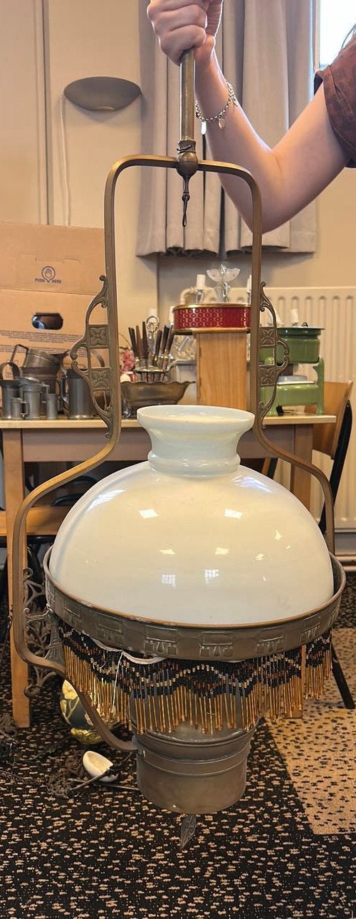 Antieke olielamp met kralen, Ophalen