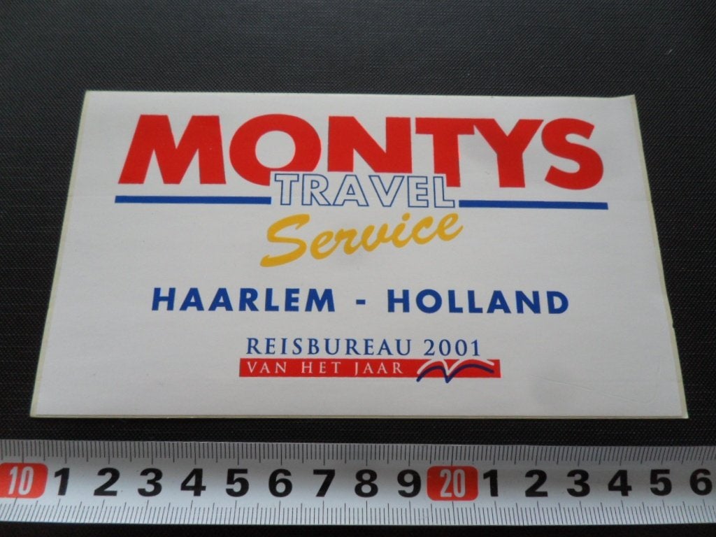 sticker haarlem MONTYS TRAVEL SERVICE reisbureau jaar 2001 *, Ophalen of Verzenden, Zo goed als nieuw
