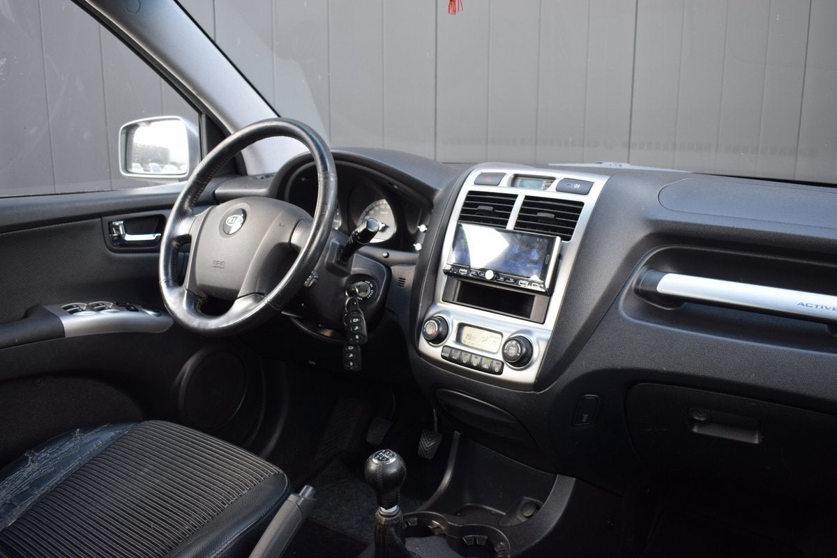 Kia Sportage 2.0 CVVT X-ecutive ECC | Half Leder | Carplay |, 1442 kg, Gebruikt, Zwart, 4 cilinders