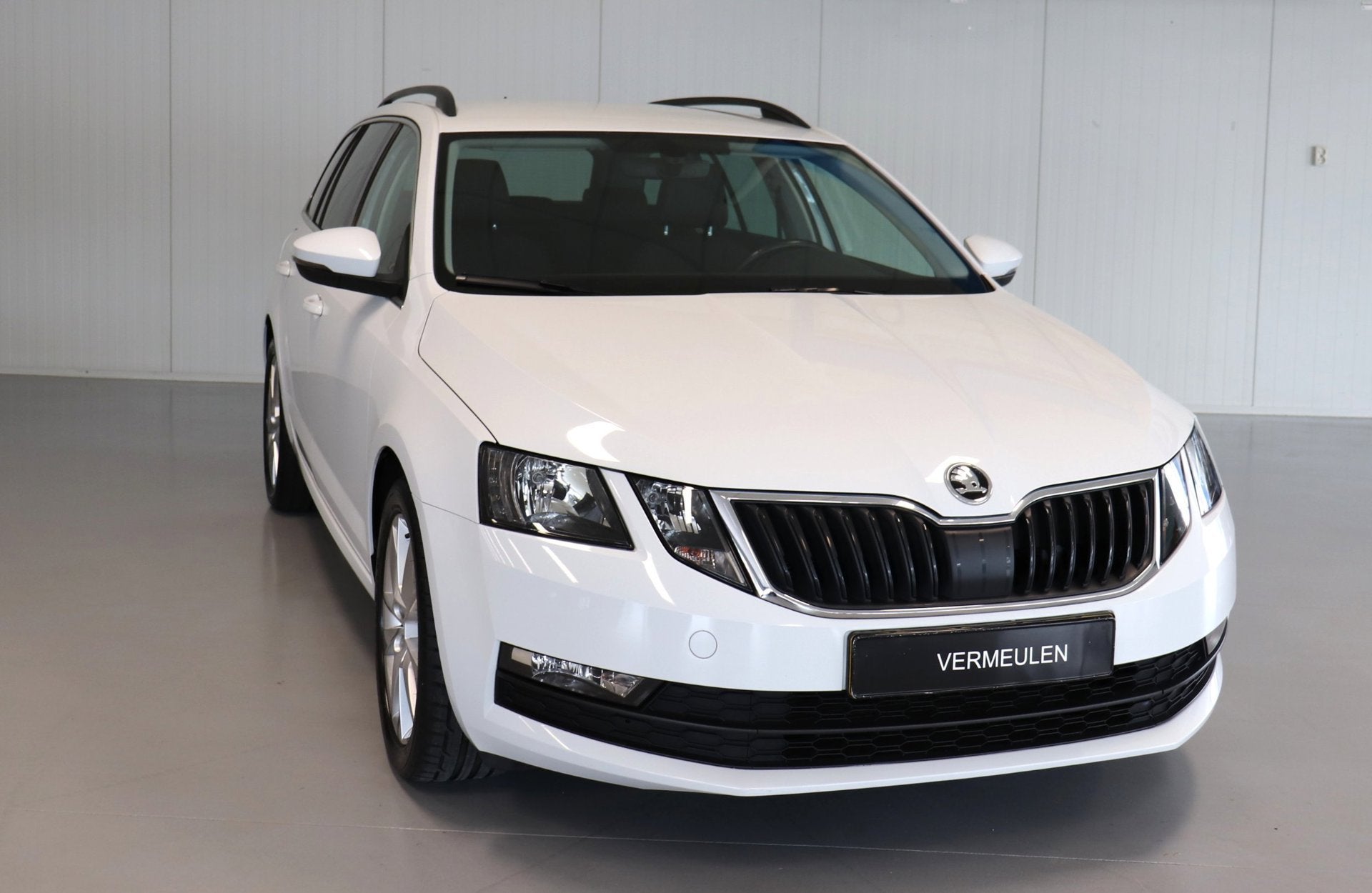 Skoda Octavia Combi 1.5 TSI Greentech Business Edition, Auto's, Skoda, 4 cilinders, 150 pk, Leder en Stof, Wit