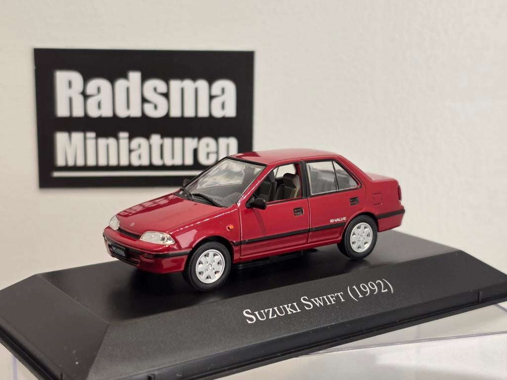 Suzuki swift sedan - 1992 - Rood - 1:43 Ixo/altaya, Overige merken, Auto, Nieuw, Ophalen of Verzenden